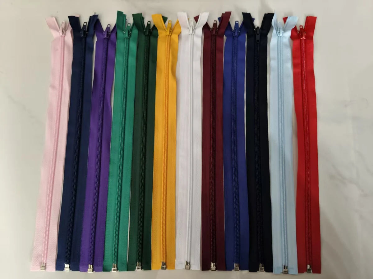 Photograph of zipper samples arranged in multiple colors